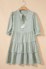 Load image into Gallery viewer, Green Stripe Tasseled Tie Neck Ruffled Short Sleeve Tiered Flattering Dress